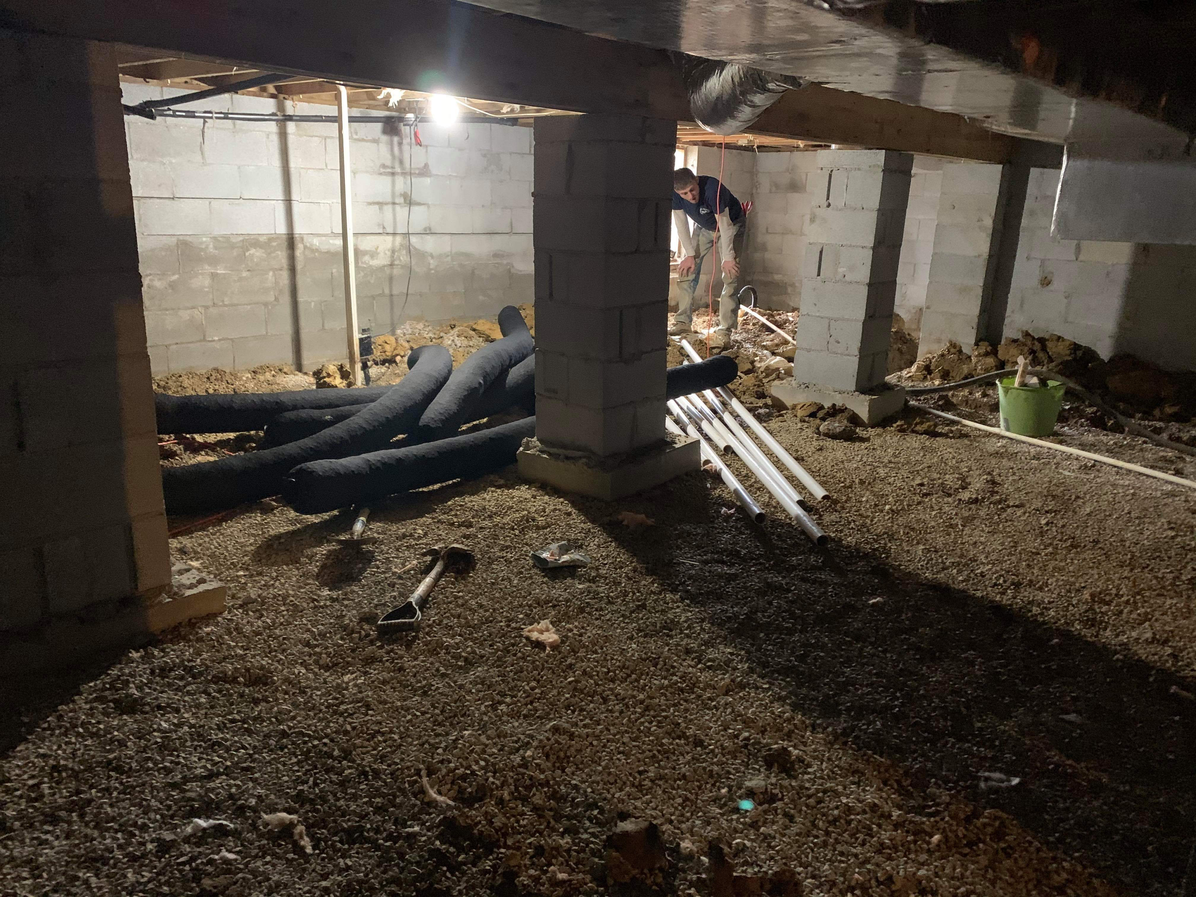 Crew leveling the crawl space