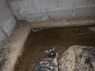 Water along the perimeter of the crawl space